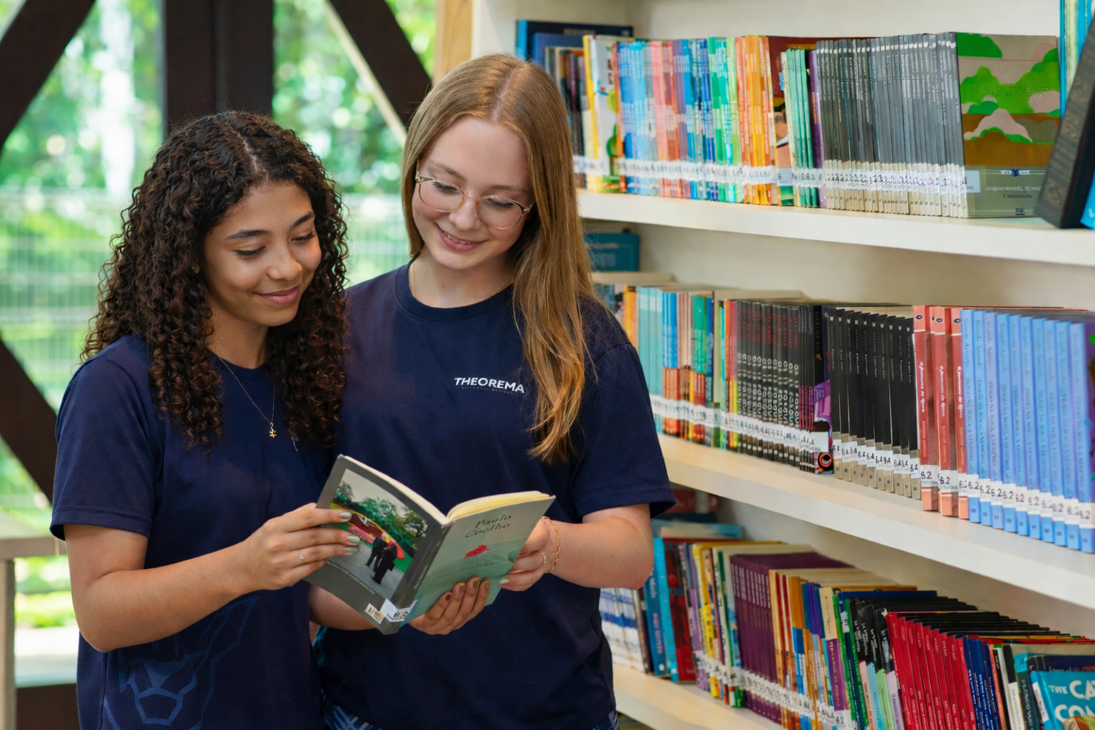 Students reading in the school library at Theorema Bilingual School in Balneário Piçarras, Santa Catarina, Brazil, a private bilingual school focused on literacy, reading and international education. Alunas na biblioteca da escola particular bilíngue em Balneário Piçarras - Theorema Bilingual Eco School
